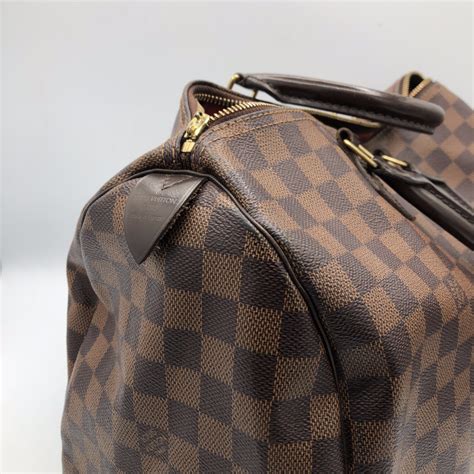 Réparation sac Louis Vuitton .